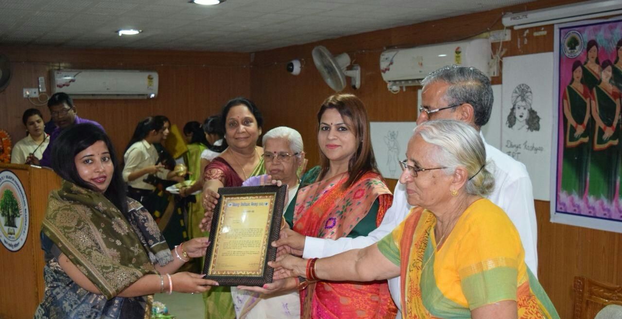 Receiving an award from Smt. Harshita Pandey, then President of the Chhattisgarh State Women Commission